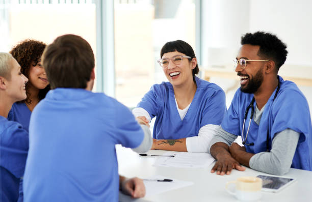 istockphoto-1268224373-612x612 Shot of a young doctor shaking hands with her colleague during a meeting in a hospital