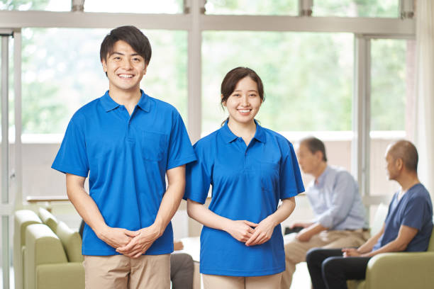 Male and female caregivers working in long-term care facilities Male and female caregivers working in long-term care facilities